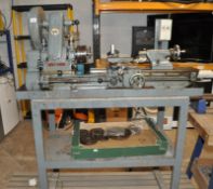 A VINTAGE MYFORD METALWORKING LATHE with a 25in bed, oil tray and metal stand with under tray and