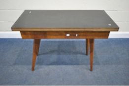 A SCANDINAVIAN STYLE FORMICA TOP FOLD OVER TABLE, the top swivels revealing a storage section,