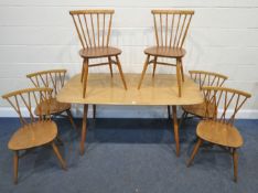 LUCIAN ERCOLANI, AN ERCOL MID-CENTURY ELM AND BEECH RECTANGULAR DINING TABLE, raised on square
