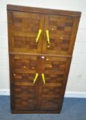 A 20TH CENTURY OAK TALLBOY, with two pairs of cupboard doors, the bottom section enclosing a clothes