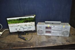 A BLAUPUNKT 24in TV/DVD with non working remote (PAT pass and working) and an Amstrad Model 8090