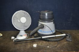 A HOOVER AQUAMASTER VACUUM CLEANER with floor head (no wet attachments) and a table top fan (both