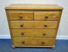A 19TH CENTURY PINE CHEST OF TWO SHORT OVER THREE GRADUATED DRAWERS, raised on bun feet, width 118cm