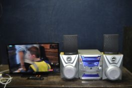 A BUSH 32in TV WITH REMOTE and a Thomson Hi Fi (one tape not playing) with remote, a pair of