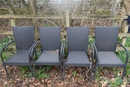 A SET OF FOUR FAUZ RATTAN STACKING ARMCHAIRS, condition report: one arm rest plastic torn (4)
