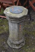 A WEATHERED COMPOSITE SUN DIAL, on an octagonal support, diameter 34cm x height 68cm, condition