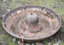 A CAST IRON MEXICAN HAT PIG FEEDER, diameter 70cm