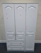 A MODERN WHITE WARDROBE, fitted with three doors, and two drawers, width 115cm x depth 57cm x height