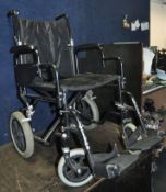 AN ENIGMA FOLDING WHEELCHAIR with two footrests