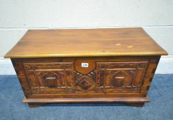 A SMALL HARDWOOD STORAGE CHEST, the hinged lid enclosing a smaller storage section, width 75cm x