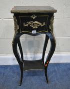 A 19TH CENTURY EBONISED WORK TABLE, foliate inlay to the lid, brass banding and mounts, raised on