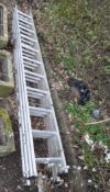 AN ABRU ALUMINIUM TRIPLE EXTENSION LADDER, with eleven rungs to each 300cm length, full extension