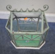 A MINT GREEN PAINTED CLOCHE, with a metal carcass, a hinged lid, and a white painted bottom edge,