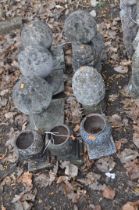 A COLLECTION OF STONE AND CONCRETE POST TOPPERS, along with three small cast iron urns, 22cm high