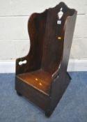 A GEORGIAN OAK CHILDS ROCKING CHAIR, with a high back, width 37cm x depth 47cm x height 74cm,