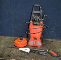 A BLACK AND DECKER PW1700SPM PRESSURE WASHER with lance, two nozzles, a car brush and a patio