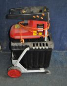 A SOVEREIGN GARDEN SHREDDER with stand and collection box (PAT pass and working)