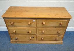 A MODERN PINE SIDEBOARD, with six drawers, length 122cm x depth 47cm x height 74cm, condition