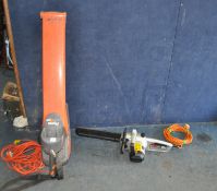 A FLYMO GARDEN VAC with collection bag and a Spear and Jackson chainsaw (both PAT pass and