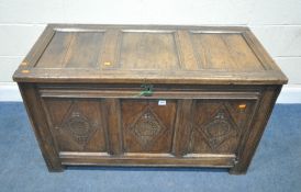 A GEORGIAN OAK BLANKET CHEST, the three front panels with geometric carved details, width 115cm x