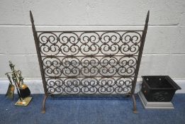 A WROUGHT IRON FIRE SCREEN, with repeating scrolled designs, height 73cm, a cast iron rain hopper,