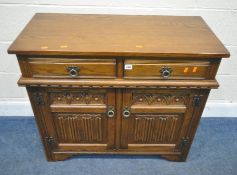 POSSIBLY OLD CHARM, A 20TH CENTURY OAK SIDEBOARD, with two drawers, over double linenfold cupboard