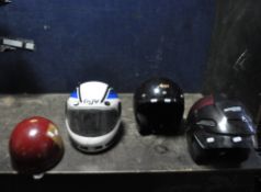 FOUR MOTORCYCLE HELMETS, including a vintage Aviakit Trackstar helmet, an AGV full faced helmet (