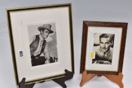 JOHN WAYNE / ERROL FLYNN two signed and framed studio photographs of the actors from the 1940's,
