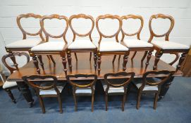 A VICTORIAN MAHOGANY EXTENDING DINING TABLE, with two additional leaves, raised
