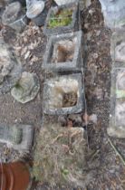 A SELECTION OF FOUR SQUARE CONCRETE PLANTERS, all with brickwork detail to sides, the largest