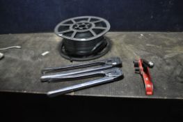A SELECTION OF BANDING EQUIPMENT, including a reel of banding strapping, a tensioner and two clip