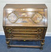 A 20TH CENTURY OAK BUREAU, the fall front door enclosing a fitted interior, over two drawers, raised