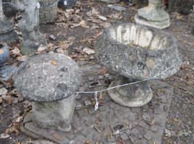 A CONCRETE TWO PIECE GARDEN URN, with acanthus leaf detailing height 36cm, and a staffed stone