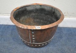 A COPPER RIVETED LOG BIN, of a tapered form, with a folded lip, diameter 52cm x depth 33cm,