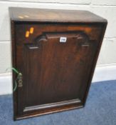 A SCRATCH BUILT GEORGIAN OAK SINGLE DOOR CABINET, with seven interior drawers, one of the drawers