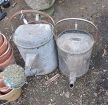 TWO EARLY 20th CENTURY GALVANISED WATERING CANS, one with a rose (2)
