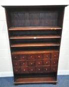 A MODERN HARDWOOD SHELVING UNIT, with eighteen small drawers, width 110cm x depth 35cm x height