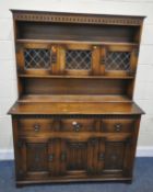 POSSIBLY MELLOWCRAFT, A 20TH CENTURY OAK DRESSER, the plate rack with two lead glazed doors,