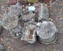 A COLLECTION OF SIX NOVELTY CONCRETE GARDEN ORNAMENTS, including a watering can, a cottage tea