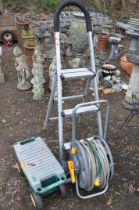 AN ALUMINIUM STEP, A HOSE REEL AND A ROLLING TOOL CHEST, containing tools (3)