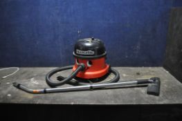 A NUMATIC NRV-200-22 VACUUM CLEANER, with pipework and floor head (PAT pass and working)