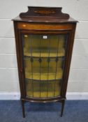 AN EDWARDIAN MAHOGANY BOW FRONT CHINA CABINET, with a raised back, marquetry inlay, a single lead