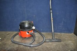 A NUMARK HVR-200-22 'HENRY' VACUUM CLEANER with pipework and floor head (PAT pass and working)