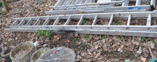 AN ALUMINIUM DOUBLE EXTENSION LADDER, with twelve rungs to each 340cm length