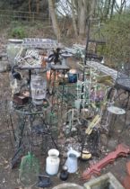 A LARGE QUANTITY OF METAL GARDEN STRUCTURES, including a scarab boot scraper, planter frames,