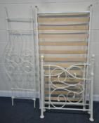 A WHITE TUBULAR METAL BED, with two ends, one heightened side rail, slats and bolts,