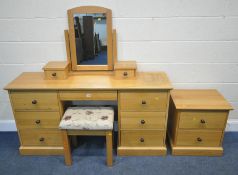 A MODERN OAK DRESSING TABLE, fitted with seven assorted drawers, length 151cm x depth 43cm x