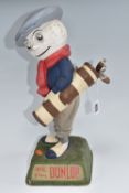 A DUNLOP CADDIE ADVERTISING FIGURE on a square naturalised base, 'We Play Dunlop' written on two
