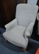A GREY PATTERNED UPHOLSTERED ARMCHAIR, raised on turned front legs, width 72cm x depth 80cm x height