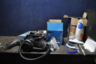AN ASDA VACUUM CLEANER IN ORIGINAL BOX, a Light 'n' easi steam mop, a Wickes angle grinder (all